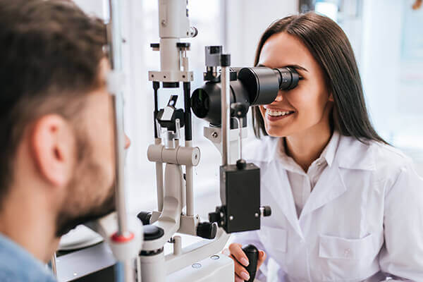 Woman giving an eye exam