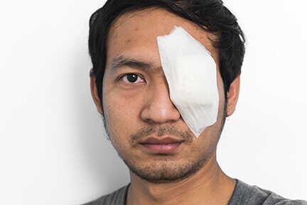 Young man with injured eye
